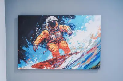 a painting of an astronaut riding a snowboard at The Seven Suites Liverpool in Liverpool