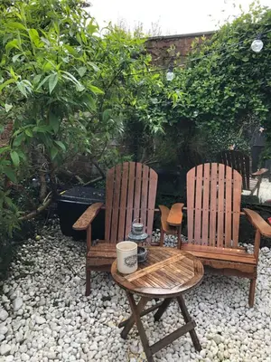 two chairs and a table with a cup on a table at Beach Flat Lytham St Annes in Lytham St Annes