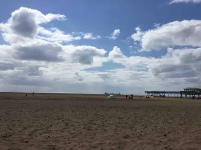 a view of a beach with a pier in the background at Beach Flat Lytham St Annes in Lytham St Annes