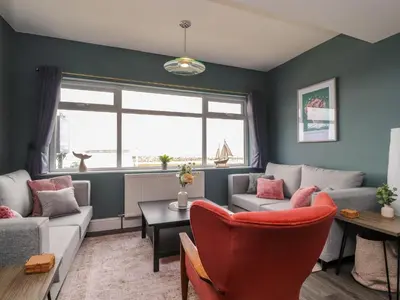 a living room with a couch and a table at Eden Bay Retreat in Morecambe