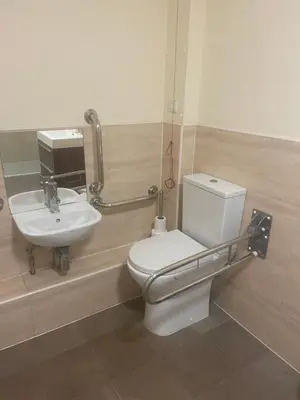 a bathroom with a toilet and a sink at The Chetwynde - Self Check In HMO in Barrow in Furness