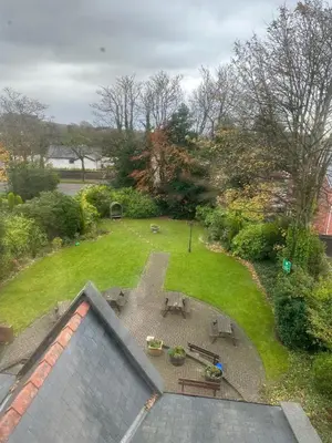 an aerial view of a garden with a patio at The Chetwynde - Self Check In HMO in Barrow in Furness