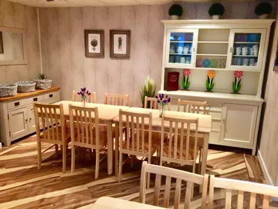 a dining room with a table and chairs at The Fylde International Guest House in Blackpool