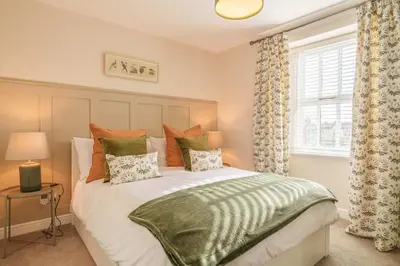a bedroom with a bed and a window at 40 The Gill - Ulverston Town Centre in Ulverston