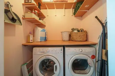 a laundry room with a washer and dryer at 40 The Gill - Ulverston Town Centre in Ulverston
