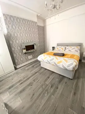 a bedroom with a bed and a fireplace at No. 206 - Spacious 5 Bed in Liverpool