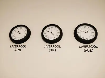 three clocks on a wall with the different time zones at 5 bedroom house, free parking, near football, sleeps 8 in Liverpool