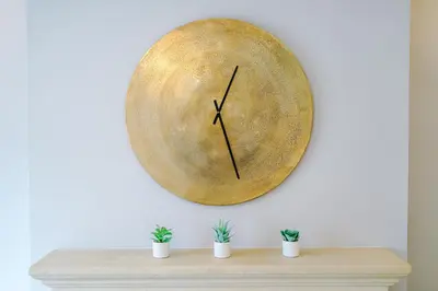 a large wooden clock hanging on a wall at Damson House- Spacious, Modern 6 bedroom Executive House - Ideal for Work Teams or Multi-Generational Families in Great Mitton