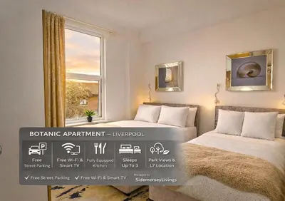 two beds in a room with a window at Sidemersey Livings - Botanic Residence in Liverpool