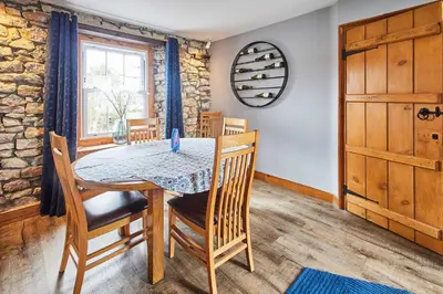 a dining room with a table and chairs at Host & Stay - Lime Tree House in Holme
