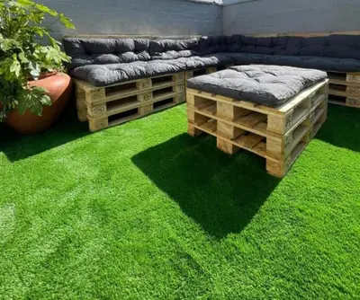 a living room with green grass and a couch at Central Luxury Town House in Blackpool