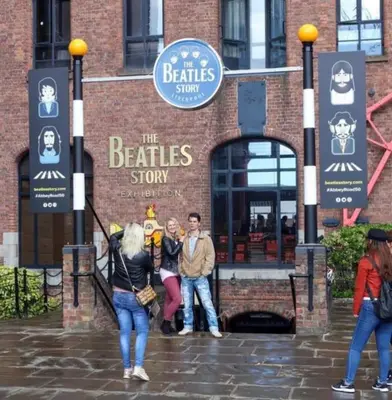 a group of people standing in front of a restaurant at Great Liverpool Location! in Liverpool