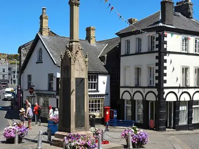 a building with a monument in the middle of a street at Uk46867 - Thirlmere in Ulverston