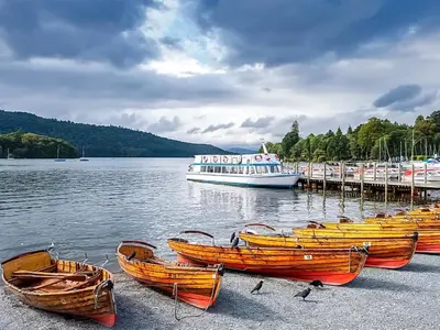 a group of boats sitting on the shore of a lake at Uk46867 - Thirlmere in Ulverston