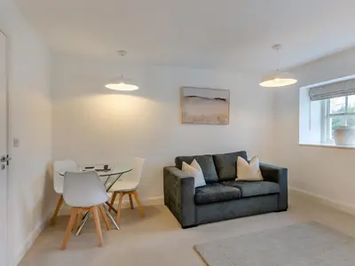 a living room with a couch and a table at Uk46867 - Thirlmere in Ulverston