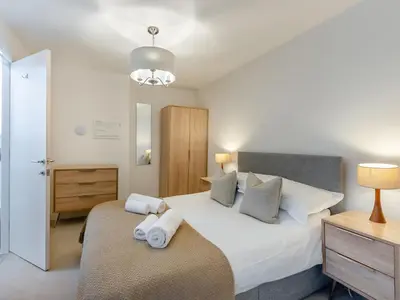 a bedroom with a bed with towels on it at Uk46867 - Thirlmere in Ulverston