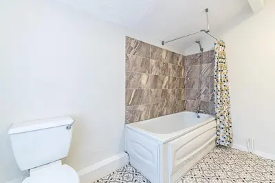 a bathroom with a toilet and a bath tub at Scott House - Air Host & Stay - Parking - Contractor friendly in Liverpool