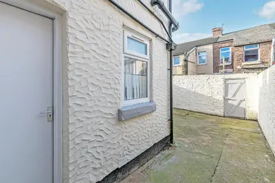 a white building with a window and a door at Scott House - Air Host & Stay - Parking - Contractor friendly in Liverpool