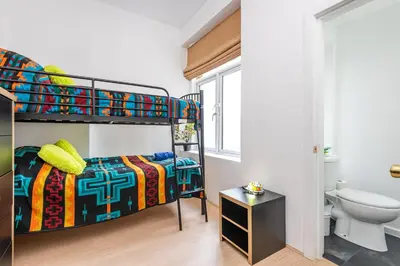 a bedroom with a bunk bed and a toilet at Christian Retreat Holiday Let in Blackpool