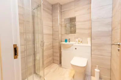 a bathroom with a toilet and a shower at Boutique 1BR Apartment in the heart of Preston in Preston