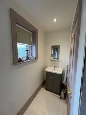 a bathroom with a sink and a mirror at Cosy hideaway in leafy Lytham in Lytham St Annes