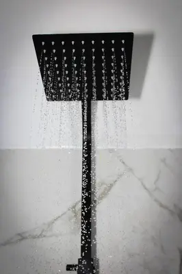 a shower head with water coming out of it at The Hideaway by Boutique 56 in Liverpool