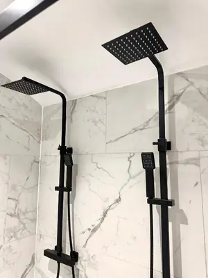 a shower with two lights in a bathroom at The Hideaway by Boutique 56 in Liverpool