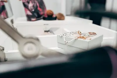 a white box with a pair of earrings on a table at Park & Relax in 1bd Central Liverpool home in Liverpool