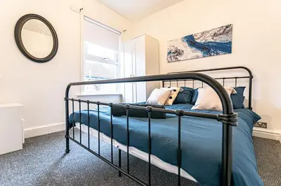a bedroom with a bunk bed with a mirror at Liverpool city centre house, Free parking in Liverpool
