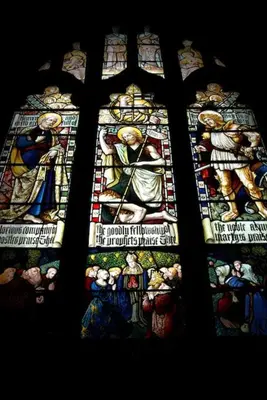 a stained glass window in a church with a group of people at Cartmel Barn: Beckside Stables in Cartmel