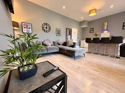 a living room with a couch and a table at Teds Apartments - Town Centre - Apt 3 in Blackpool