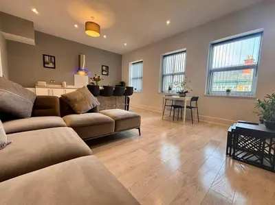 a living room with a couch and a table at Teds Apartments - Town Centre - Apt 3 in Blackpool