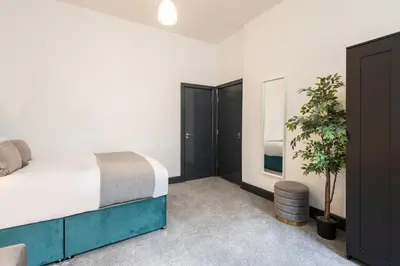 a bedroom with a bed and a potted plant at Host & Stay - Exchange Street Living in Liverpool