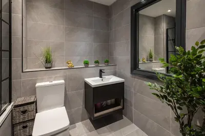 a bathroom with a toilet and a sink and a mirror at Host & Stay - Exchange Street Living in Liverpool