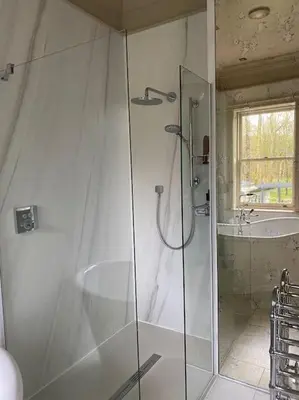 a bathroom with a shower and a sink at Home Farm Cottage in Lytham St Annes