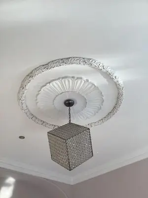 a ceiling light with a circular design on a ceiling at Aachen Hotel in Liverpool