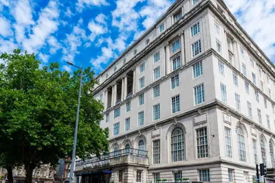 a large white building on a city street at Adelphi Hotel in Liverpool