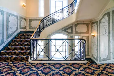 a spiral staircase in a building with a stair case at Adelphi Hotel in Liverpool