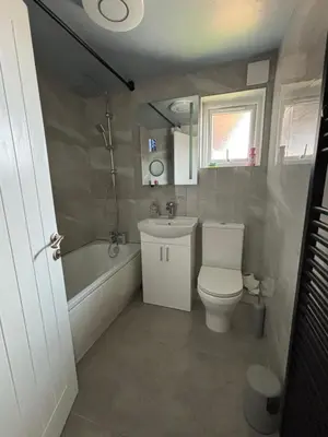 a small bathroom with a toilet and a sink at Modern Luxury apartment Liverpool in Liverpool