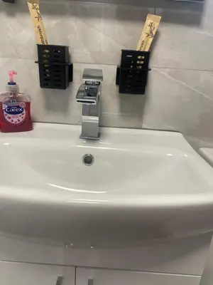 a bathroom sink with a faucet on top of it at Modern Luxury apartment Liverpool in Liverpool