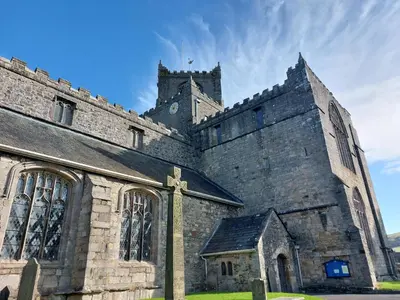 an old church with a clock tower on top of it at Sunnydale, Cartmel in Cartmel