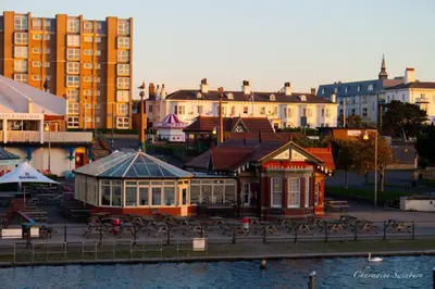 a view of a city with a building and buildings at Seaside Retreat - 2BR Apt in Southport in Southport