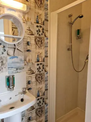 a bathroom with a sink and a shower at Beverley Dean - Children Over 5 Years Welcome - Continental Breakfast in Blackpool