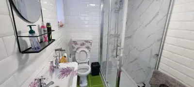 a white bathroom with a toilet and a shower at The Hideaway ll private garden Quiet Central in Southport
