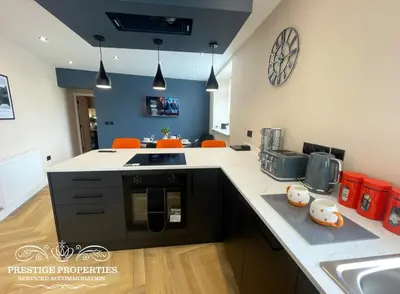 a kitchen with a sink and a counter top at Orange View by Prestige Properties SA in Haverigg