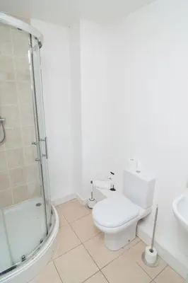 a bathroom with a shower and a toilet and a sink at 2 bed 2 bath city centre sleep 7 in Liverpool
