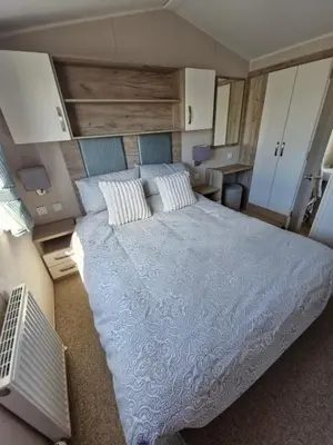 a bedroom with a large bed in a room at Willaby skye in Heysham