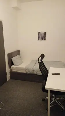 a room with a bed and a desk and a chair at Single Room with Private Bath Free Street Parking Near LFC No Breakfast in Liverpool