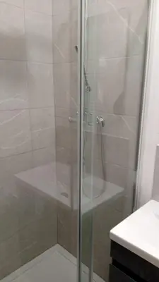 a shower with a glass door in a bathroom at Single Room with Private Bath Free Street Parking Near LFC No Breakfast in Liverpool