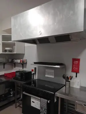 a kitchen with a stove top oven in a kitchen at Single Room with Private Bath Free Street Parking Near LFC No Breakfast in Liverpool